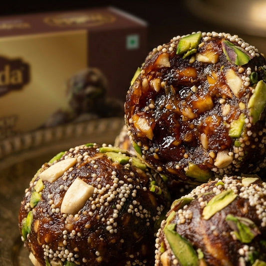 Walida's Special Khajoor Laddus on a plate with Walida packaging in the background